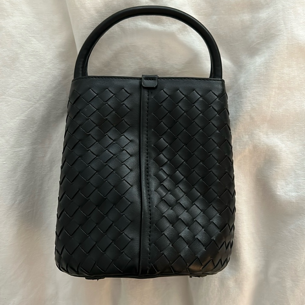 Black woven bucket bag